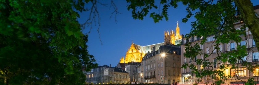 A night view of a city's illuminated buildings.